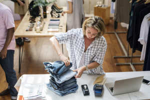 Woman folding jeans